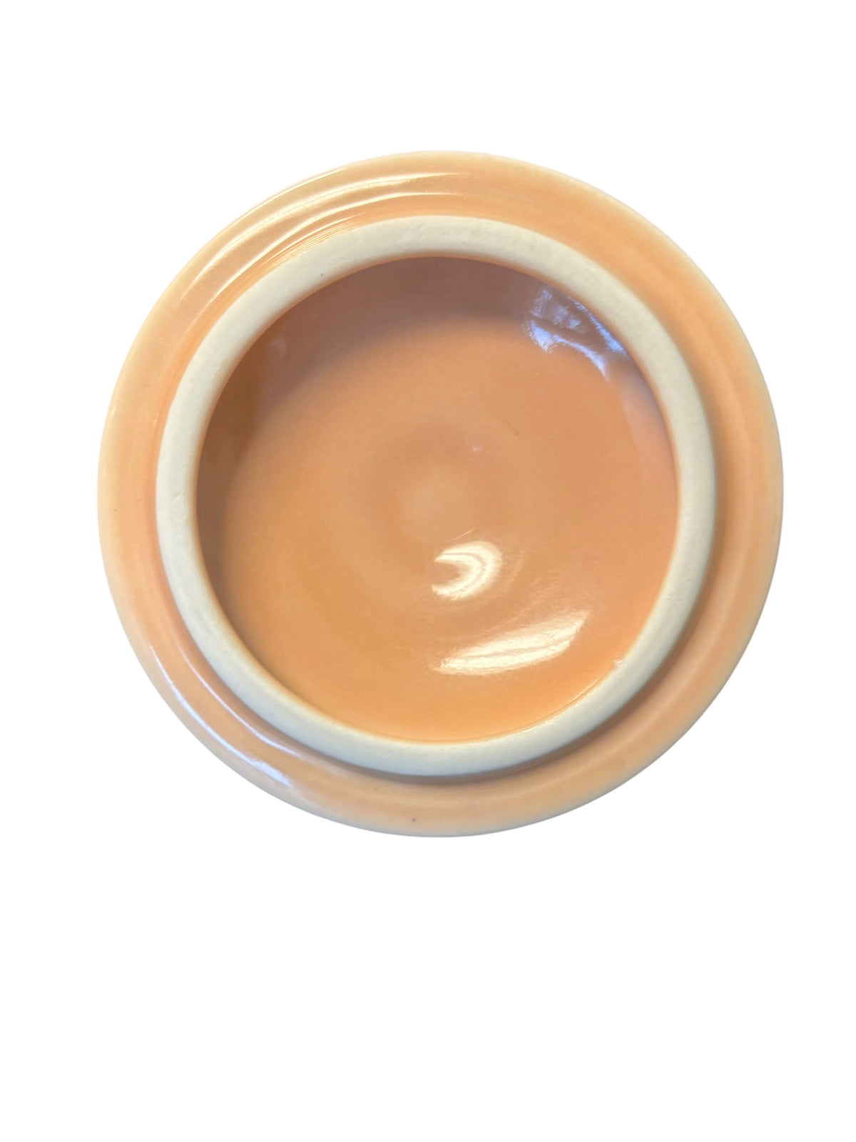 This is a Fiesta Fiestaware Individual Sugar Bowl With Lid in Apricot. lead-free, Post 1986, Retired Color Retired Shape
