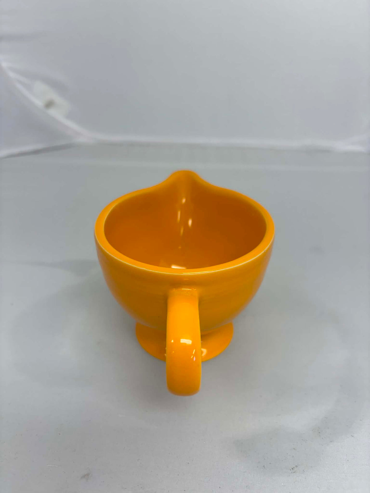 This is a Fiesta Fiestaware individual cream pitcher creamer in Butterscotch. lead-free, Post 1986, Retired Color Retired Shape New With Tags
