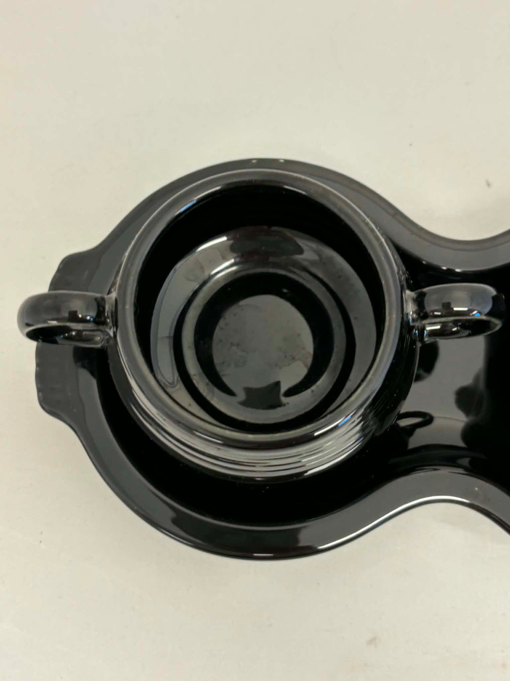 This is a Fiesta Fiestaware Creamer Pitcher Sugar Bowl with Lid on Figure Eight 8 Tray Set in black. lead-free, Post 1986, Retired Color Retired Shape
