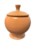 This is a Fiesta Fiestaware Individual Sugar Bowl With Lid in Apricot. lead-free, Post 1986, Retired Color Retired Shape
