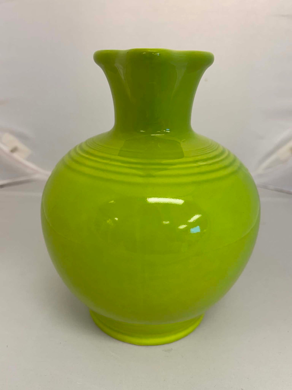 This is a Fiesta Fiestware small 60 Ounce Carafe in chartreuse. Lead-free Post 1986 Retired color retired shape
