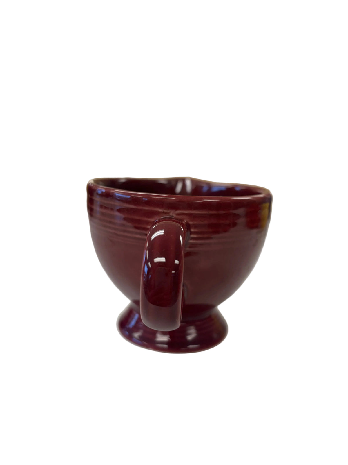 This is a Fiesta Fiestaware individual cream pitcher creamer in Cinnabar. lead-free, Post 1986, Retired Color Retired Shape

