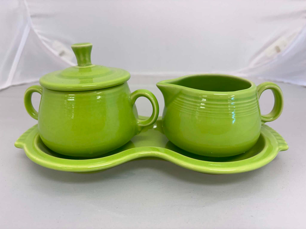 This is a Fiesta Fiestaware Creamer Pitcher Sugar Bowl with Lid on Figure Eight 8 Tray Set in chartreuse lead-free, Post 1986, Retired Color Retired Shape

