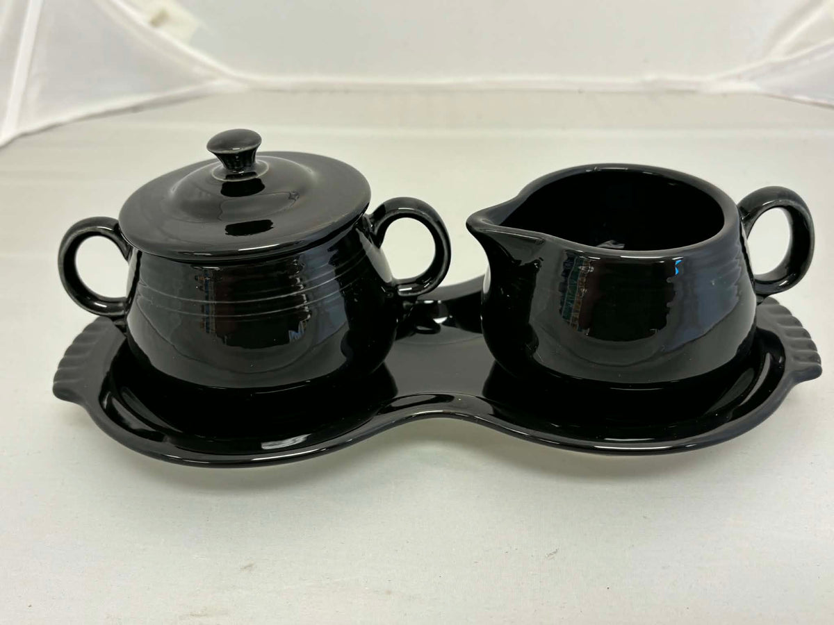 This is a Fiesta Fiestaware Creamer Pitcher Sugar Bowl with Lid on Figure Eight 8 Tray Set in black. lead-free, Post 1986, Retired Color Retired Shape
