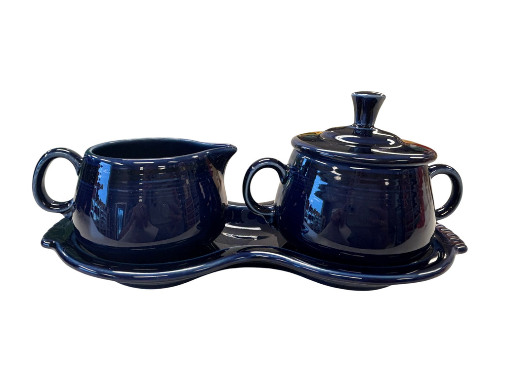 This is a Fiesta Fiestaware Creamer Pitcher Sugar Bowl with Lid on Figure Eight 8 Tray Set in cobalt lead-free, Post 1986, Retired Color Retired Shape
