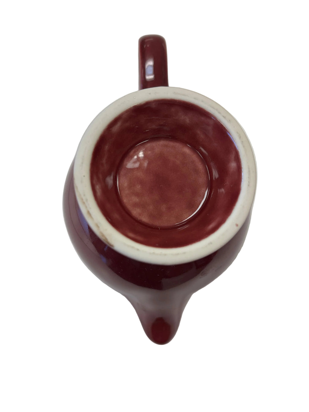 This is a Fiesta Fiestaware individual cream pitcher creamer in Cinnabar. lead-free, Post 1986, Retired Color Retired Shape
