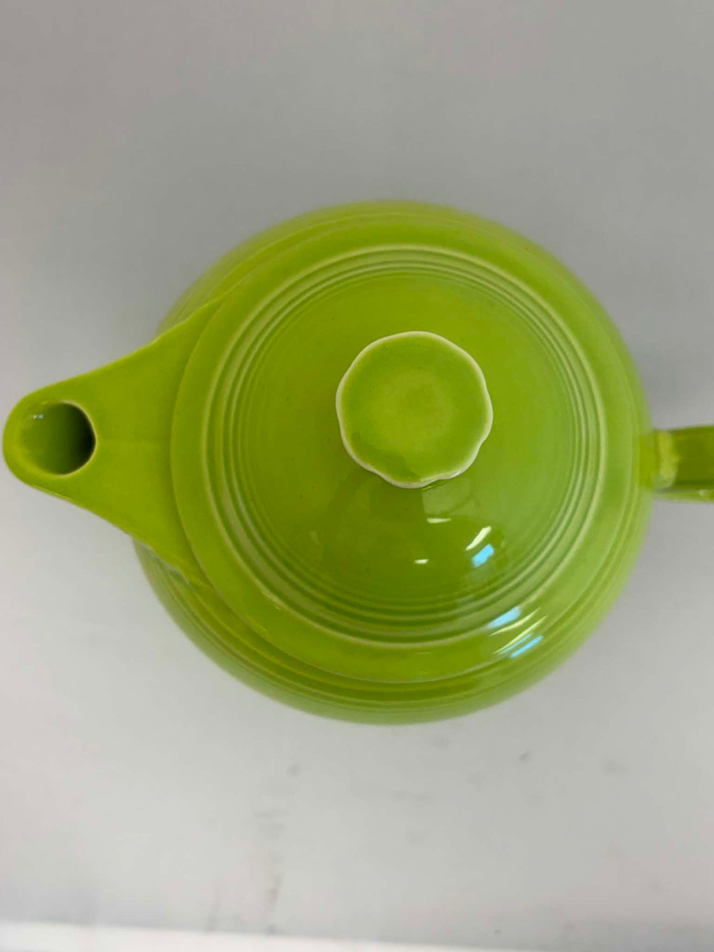 This is a Fiesta Fiestaware Five-cup 5-cup Ring Handled Tea Pot with Lid in Chartreuse. lead-free, Post 1986, Retired Color Retired Shape
