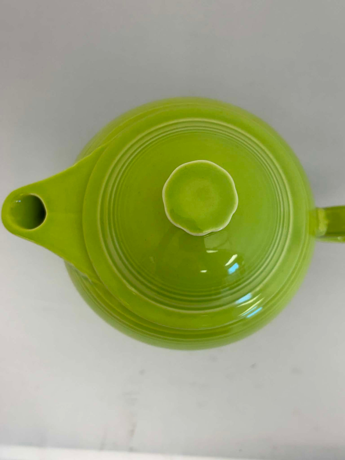 This is a Fiesta Fiestaware Five-cup 5-cup Ring Handled Tea Pot with Lid in Chartreuse. lead-free, Post 1986, Retired Color Retired Shape
