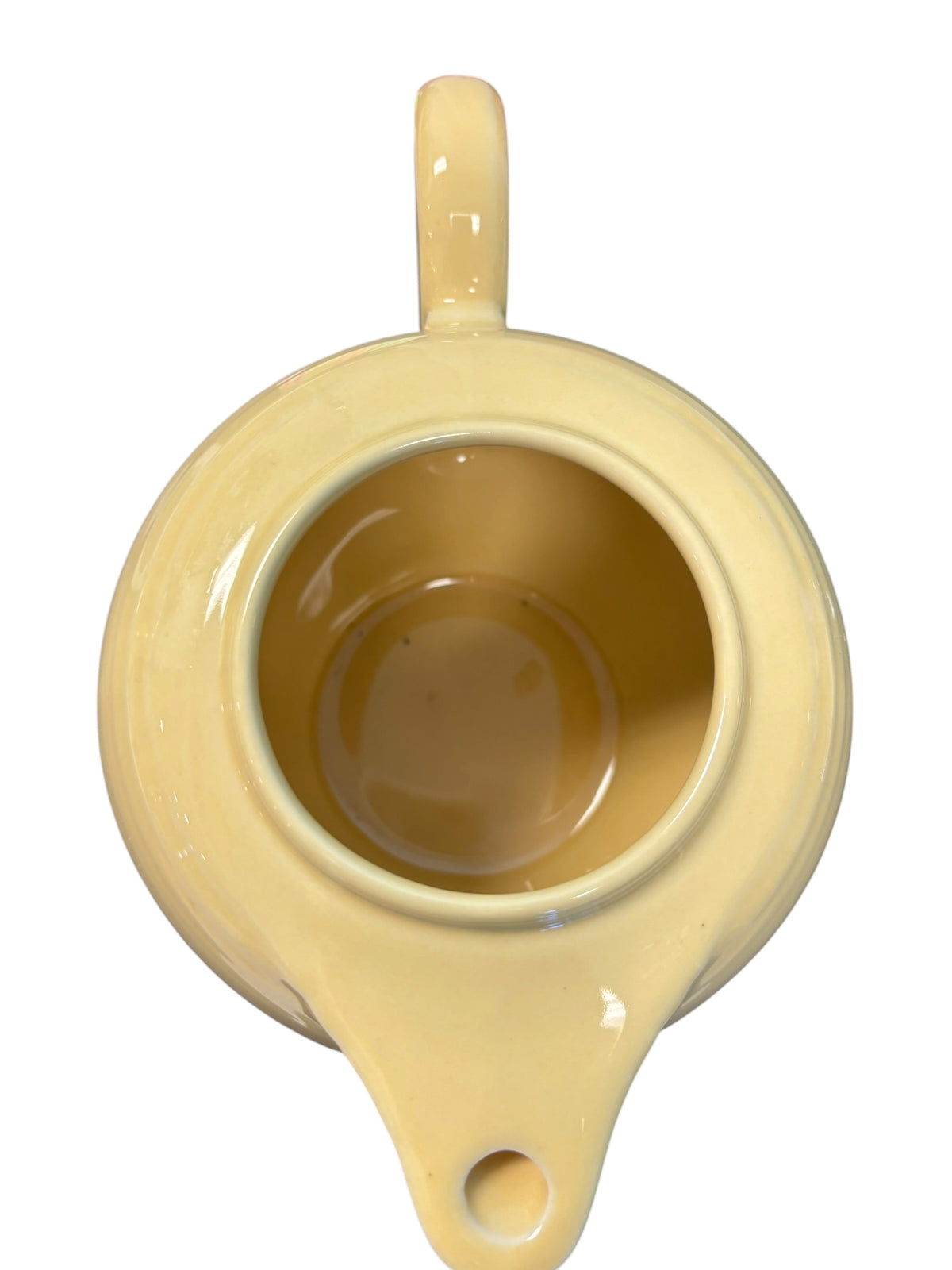 This is a Fiesta Fiestaware Five-cup 5-cup Ring Handled Tea Pot with Lid in Ivory. lead-free, Post 1986, Retired Color Retired Shape
