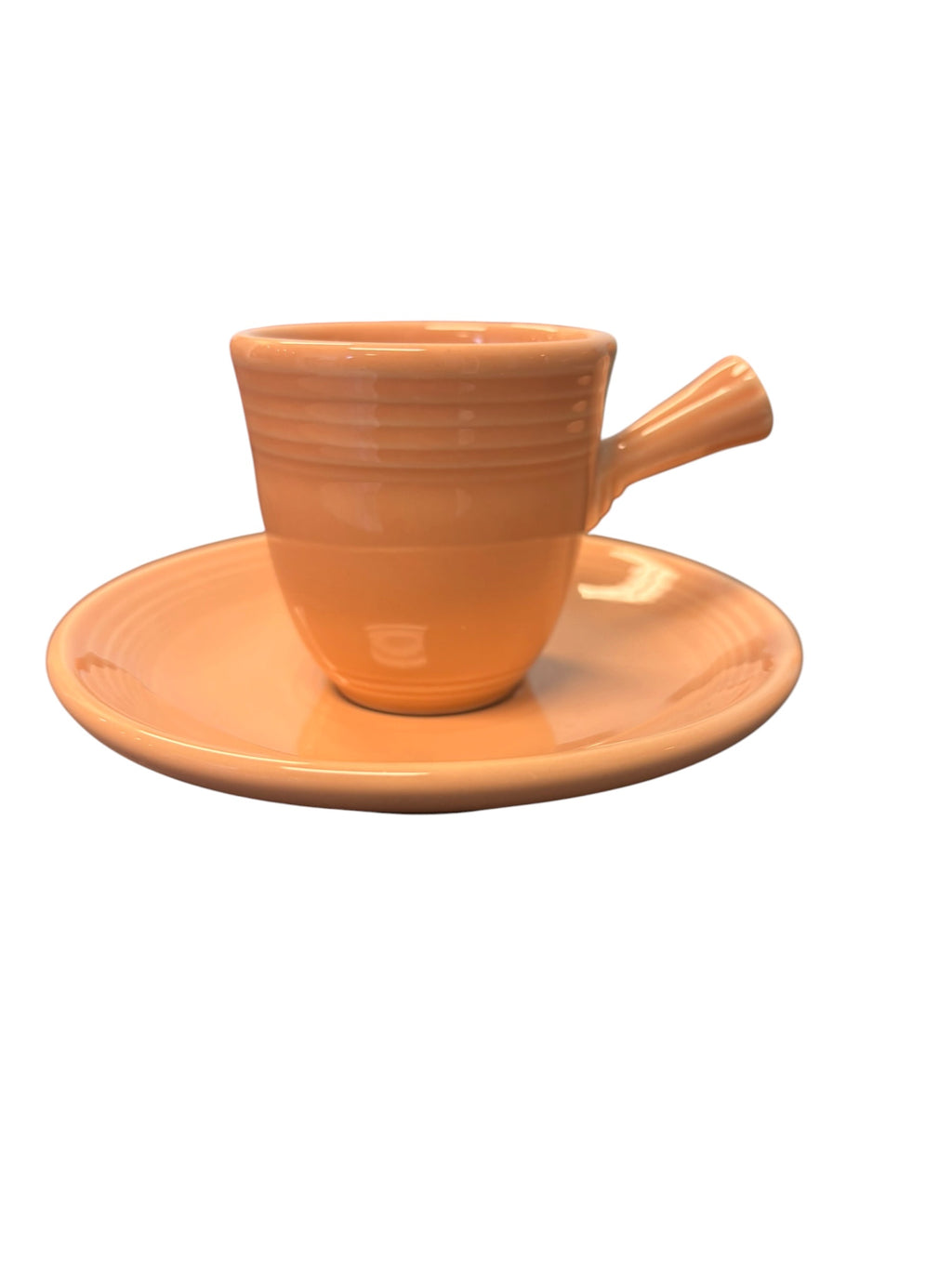 This is a Fiesta Fiestaware After Dinner AD Stick Handled Demitasse Demi Cup and Saucer Set in Apricot. lead-free, Post 1986, Retired Color Retired Shape Perfect for Espresso