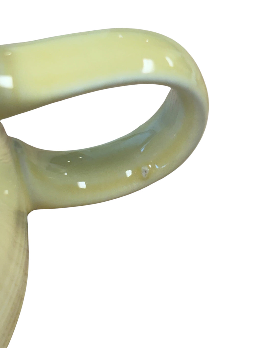 This is a Fiesta Fiestaware individual cream pitcher creamer in Yellow. lead-free, Post 1986, Retired Color Retired Shape
