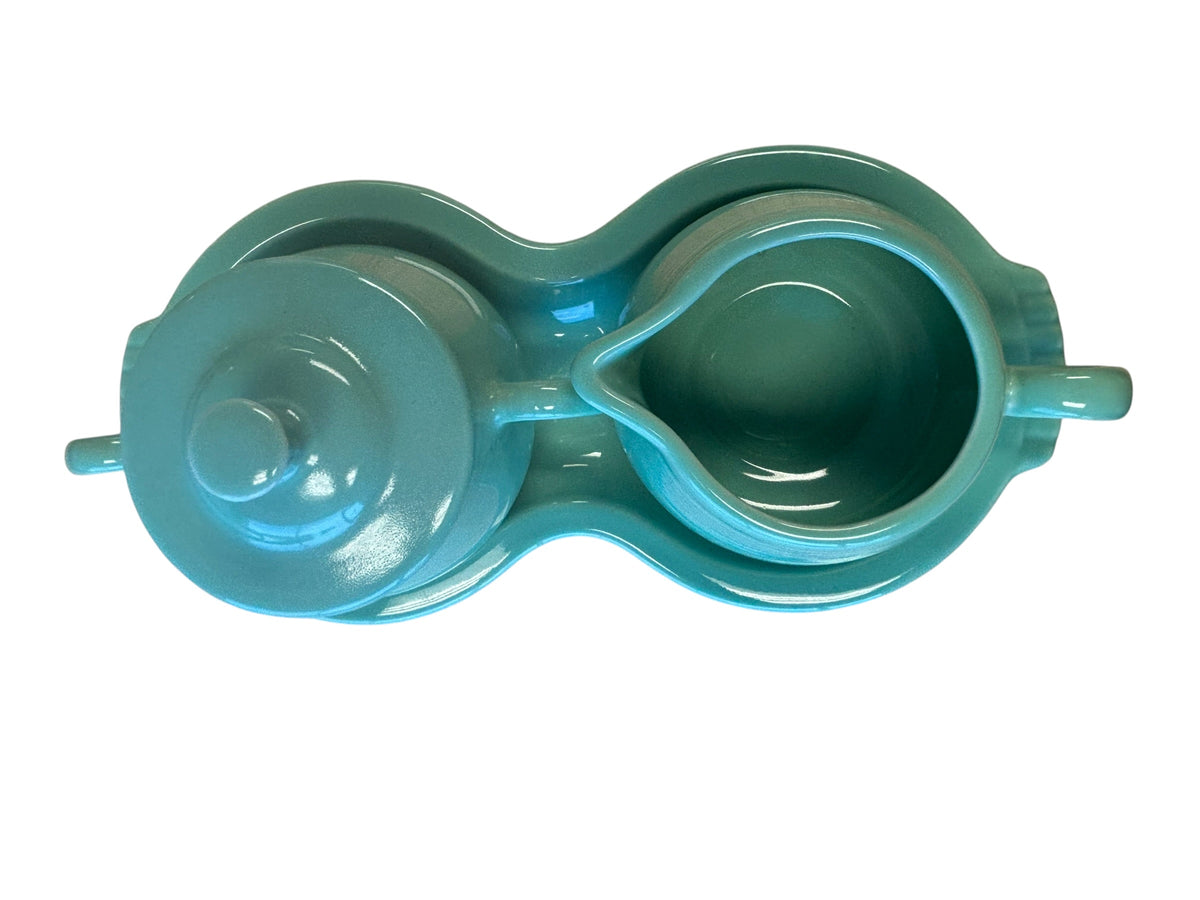 This is a Fiesta Fiestaware Creamer Pitcher Sugar Bowl with Lid on Figure Eight 8 Tray Set in Sea Mist Green. lead-free, Post 1986, Retired Color Retired Shape
