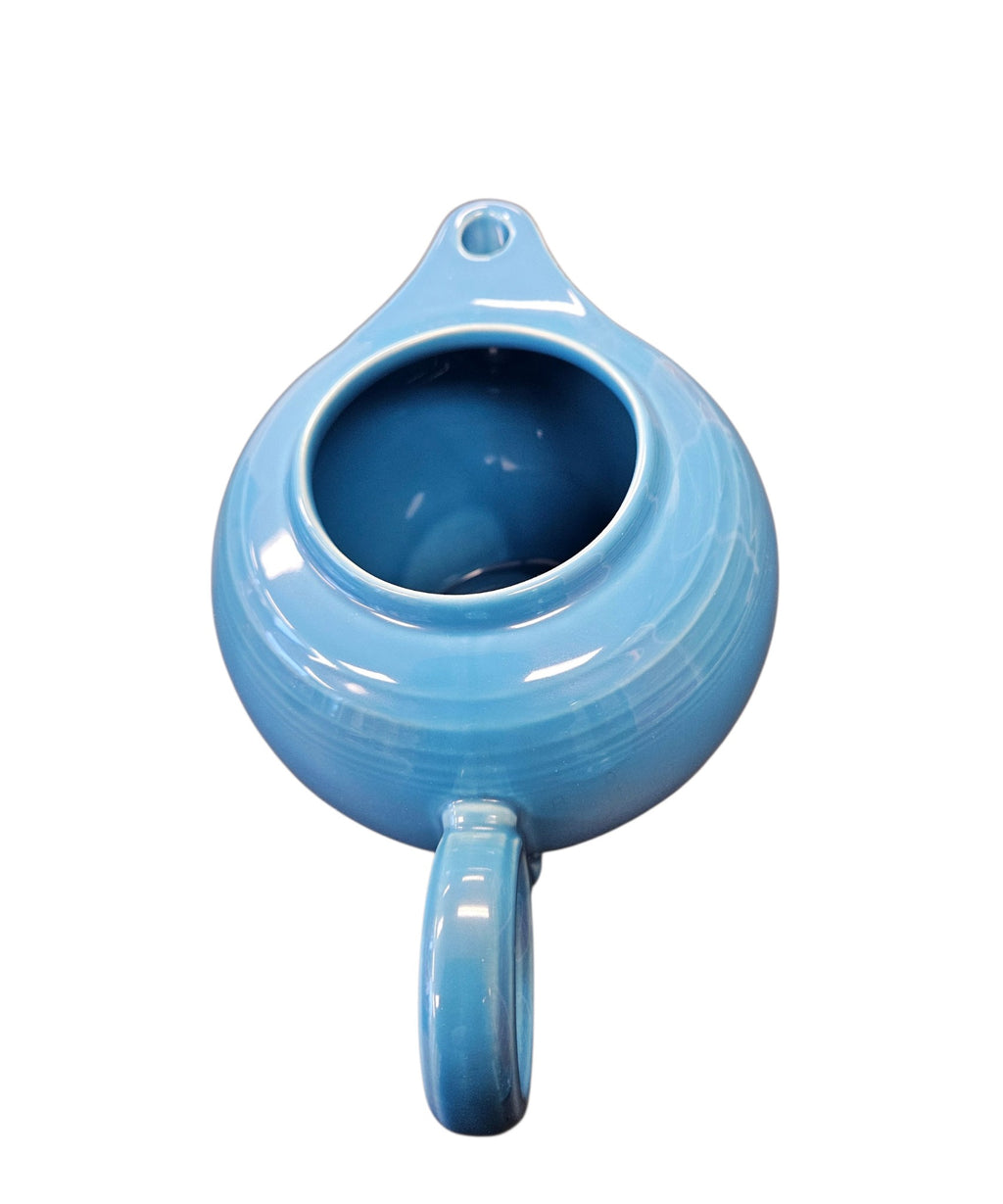 This is a Fiesta Fiestaware Five-cup 5-cup Ring Handled Tea Pot with Lid in Peacock. lead-free, Post 1986, Retired Color Retired Shape
