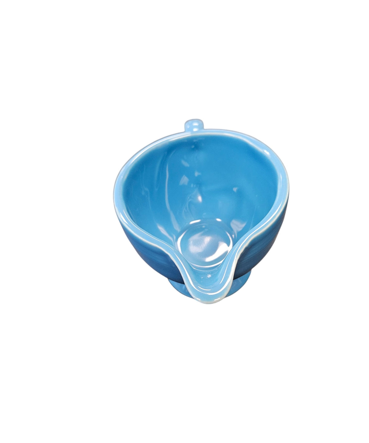 This is a Fiesta Fiestaware individual cream pitcher creamer in Peacock. lead-free, Post 1986, Retired Color Retired Shape
