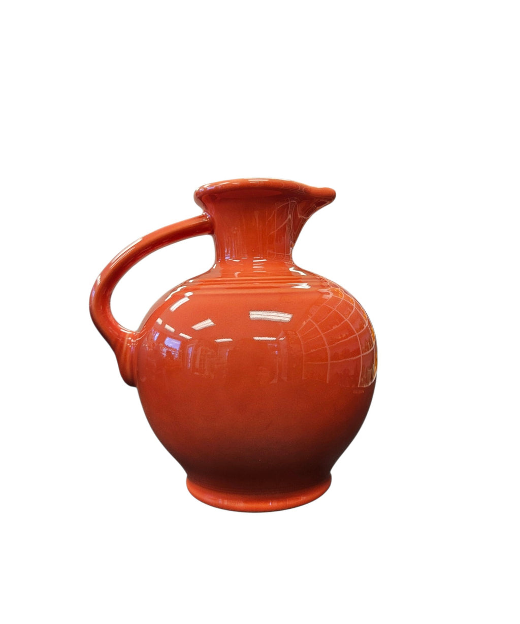 This is a Fiesta Fiestware small 60 Ounce Carafe in persimmon. Lead-free Post 1986 Retired color retired shape
