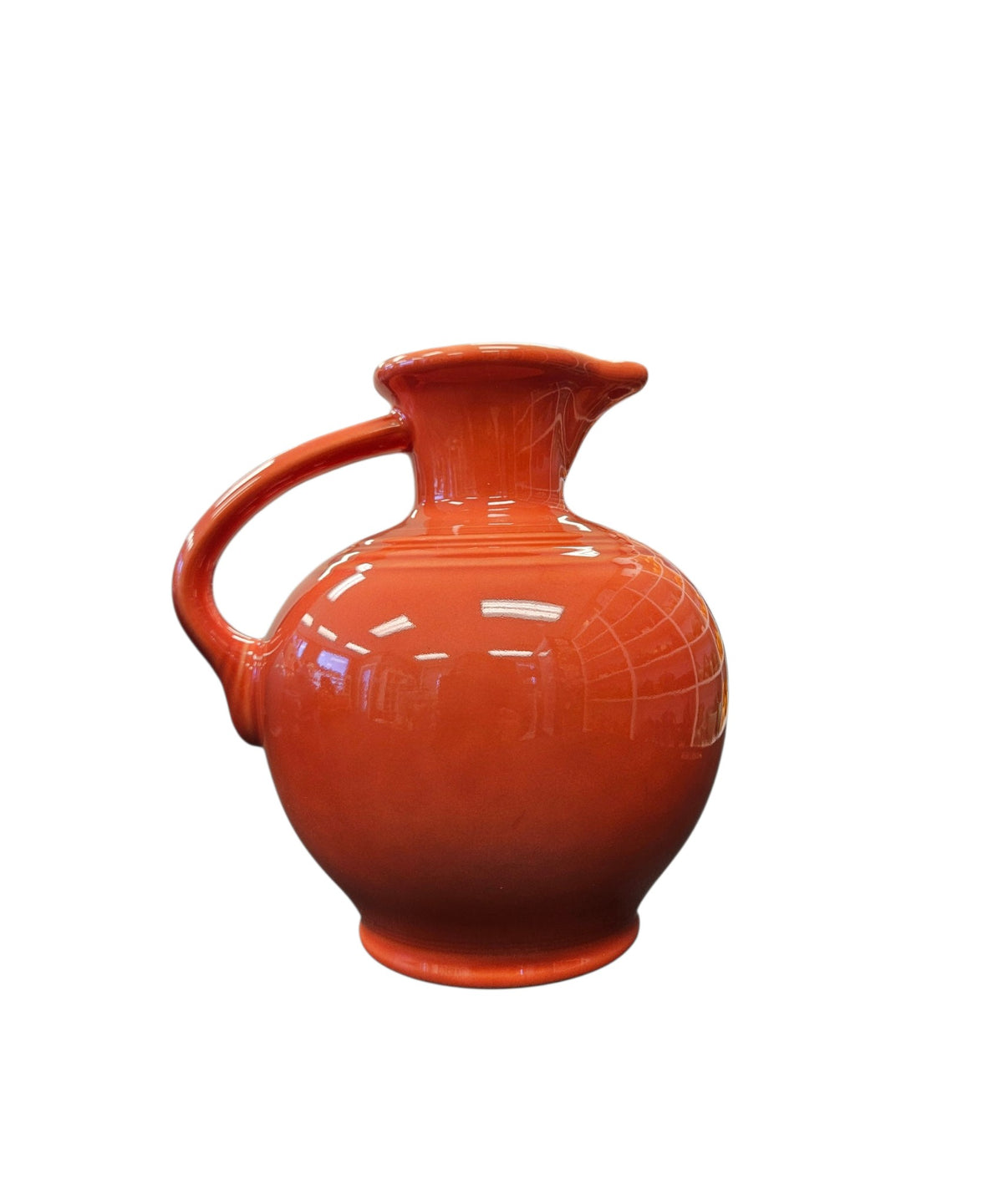 This is a Fiesta Fiestware small 60 Ounce Carafe in persimmon. Lead-free Post 1986 Retired color retired shape

