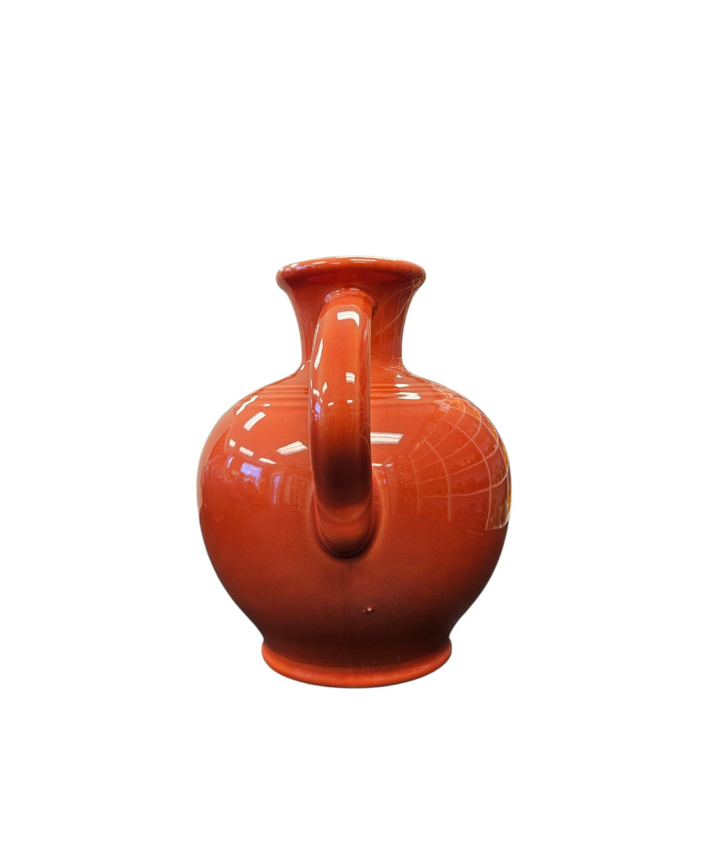 This is a Fiesta Fiestware small 60 Ounce Carafe in persimmon. Lead-free Post 1986 Retired color retired shape
