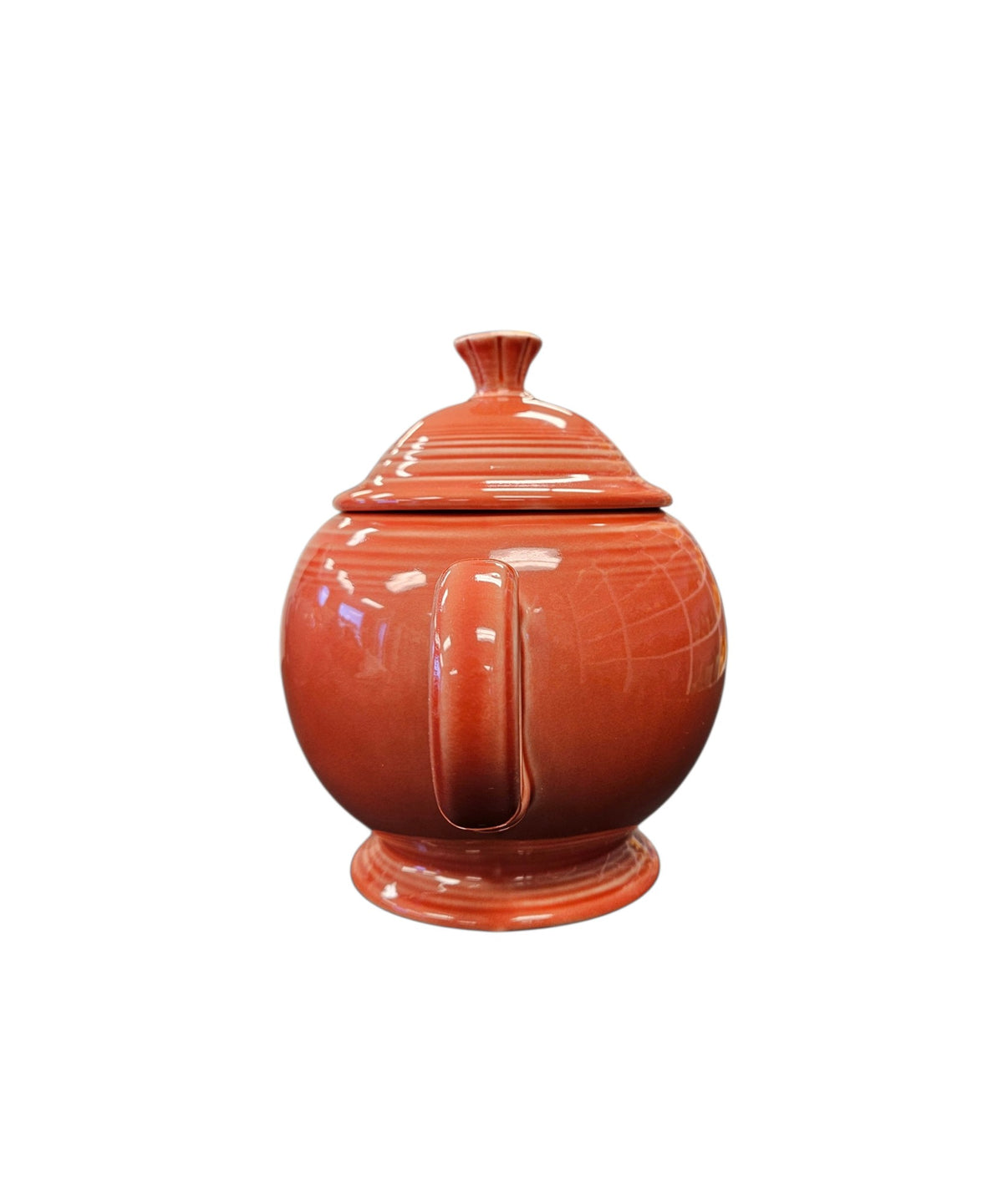 This is a Fiesta Fiestaware Five-cup 5-cup Ring Handled Tea Pot with Lid in Persimmon. lead-free, Post 1986, Retired Color Retired Shape

