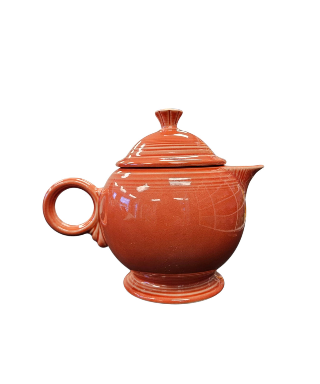 This is a Fiesta Fiestaware Five-cup 5-cup Ring Handled Tea Pot with Lid in Persimmon. lead-free, Post 1986, Retired Color Retired Shape
