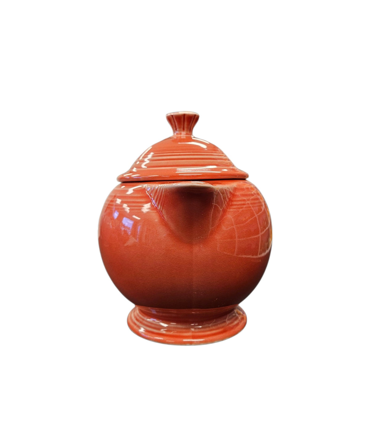 This is a Fiesta Fiestaware Five-cup 5-cup Ring Handled Tea Pot with Lid in Persimmon. lead-free, Post 1986, Retired Color Retired Shape
