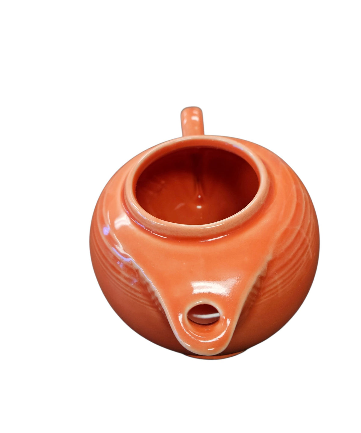 This is a Fiesta Fiestaware Five-cup 5-cup Ring Handled Tea Pot with Lid in Persimmon. lead-free, Post 1986, Retired Color Retired Shape
