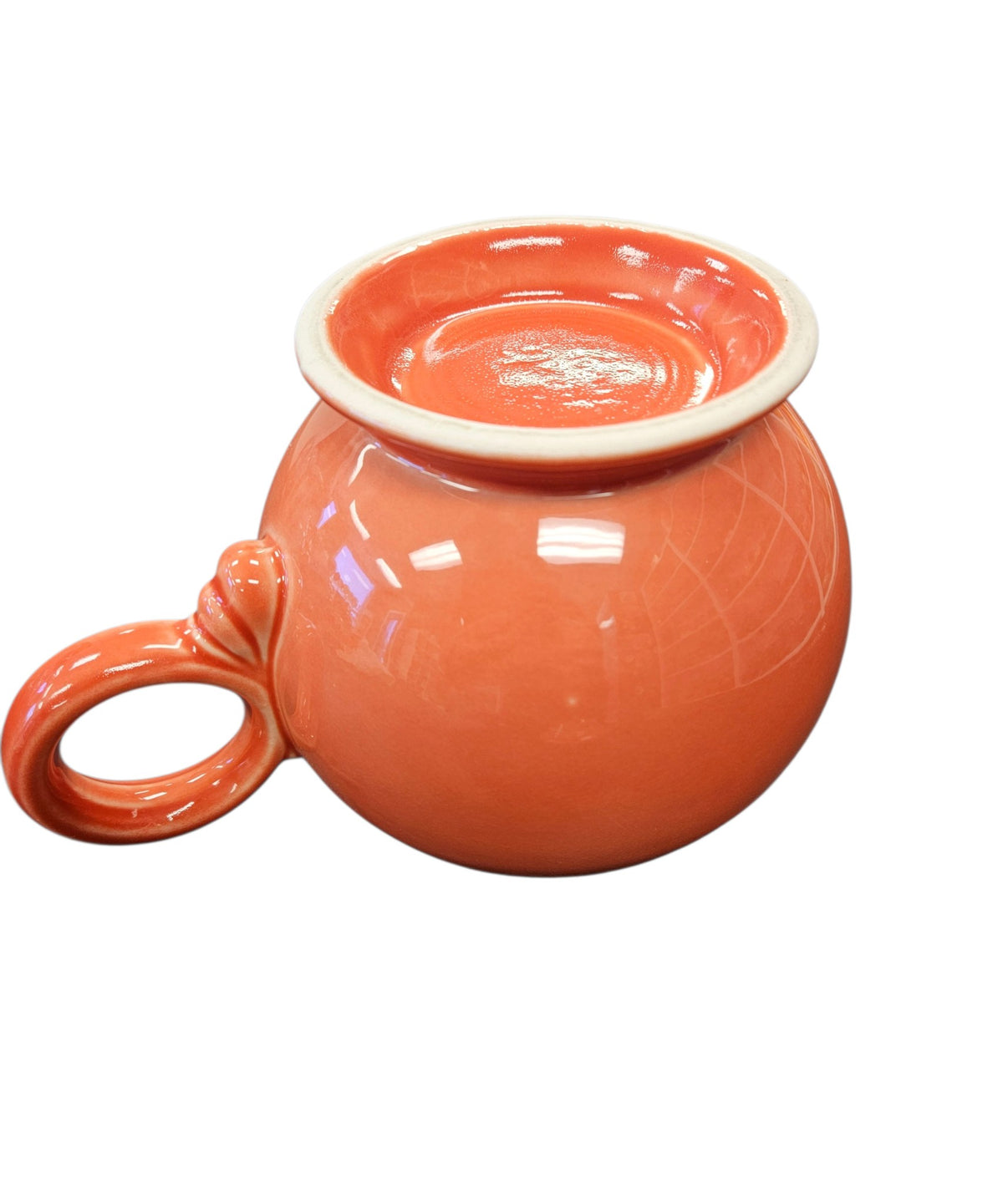 This is a Fiesta Fiestaware Five-cup 5-cup Ring Handled Tea Pot with Lid in Persimmon. lead-free, Post 1986, Retired Color Retired Shape
