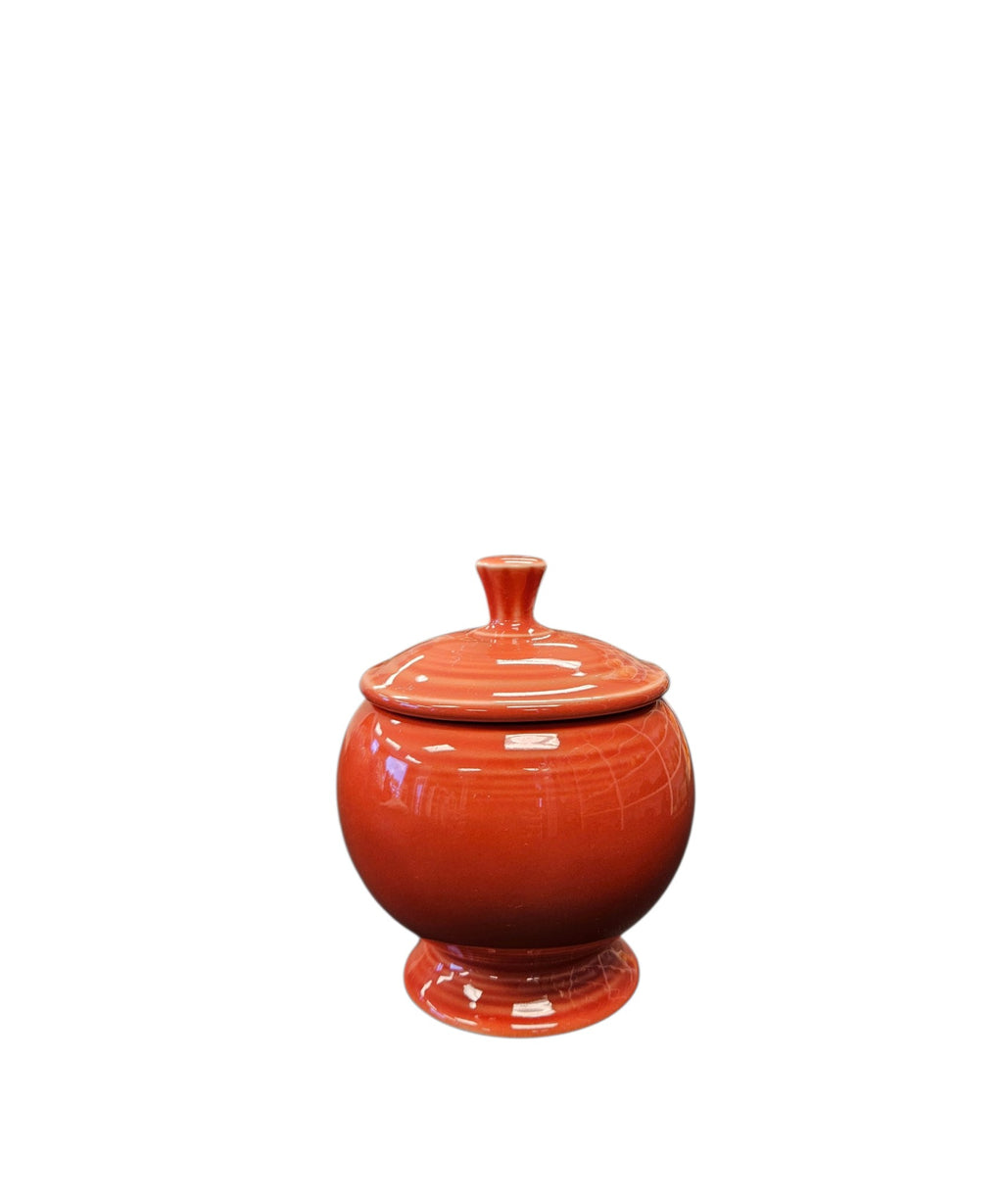 This is a Fiesta Fiestaware Individual Sugar Bowl With Lid in Persimmon. lead-free, Post 1986, Retired Color Retired Shape
