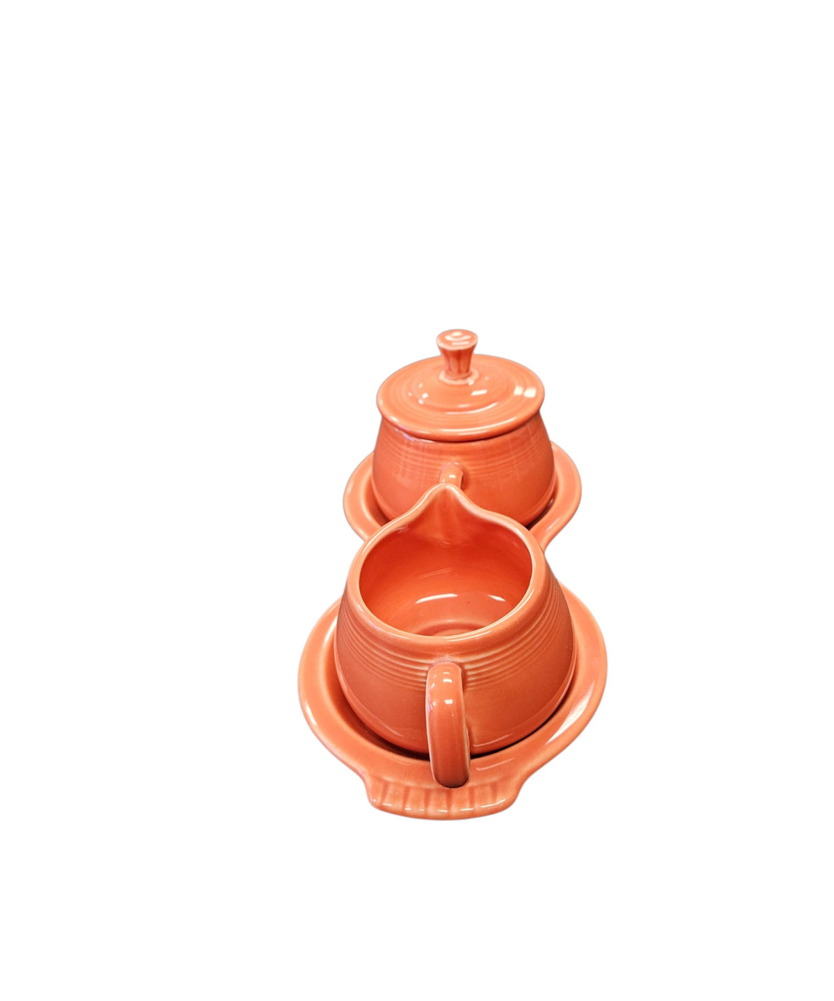 This is a Fiesta Fiestaware Creamer Pitcher Sugar Bowl with Lid on Figure Eight 8 Tray Set in persimmon lead-free, Post 1986, Retired Color Retired Shape
