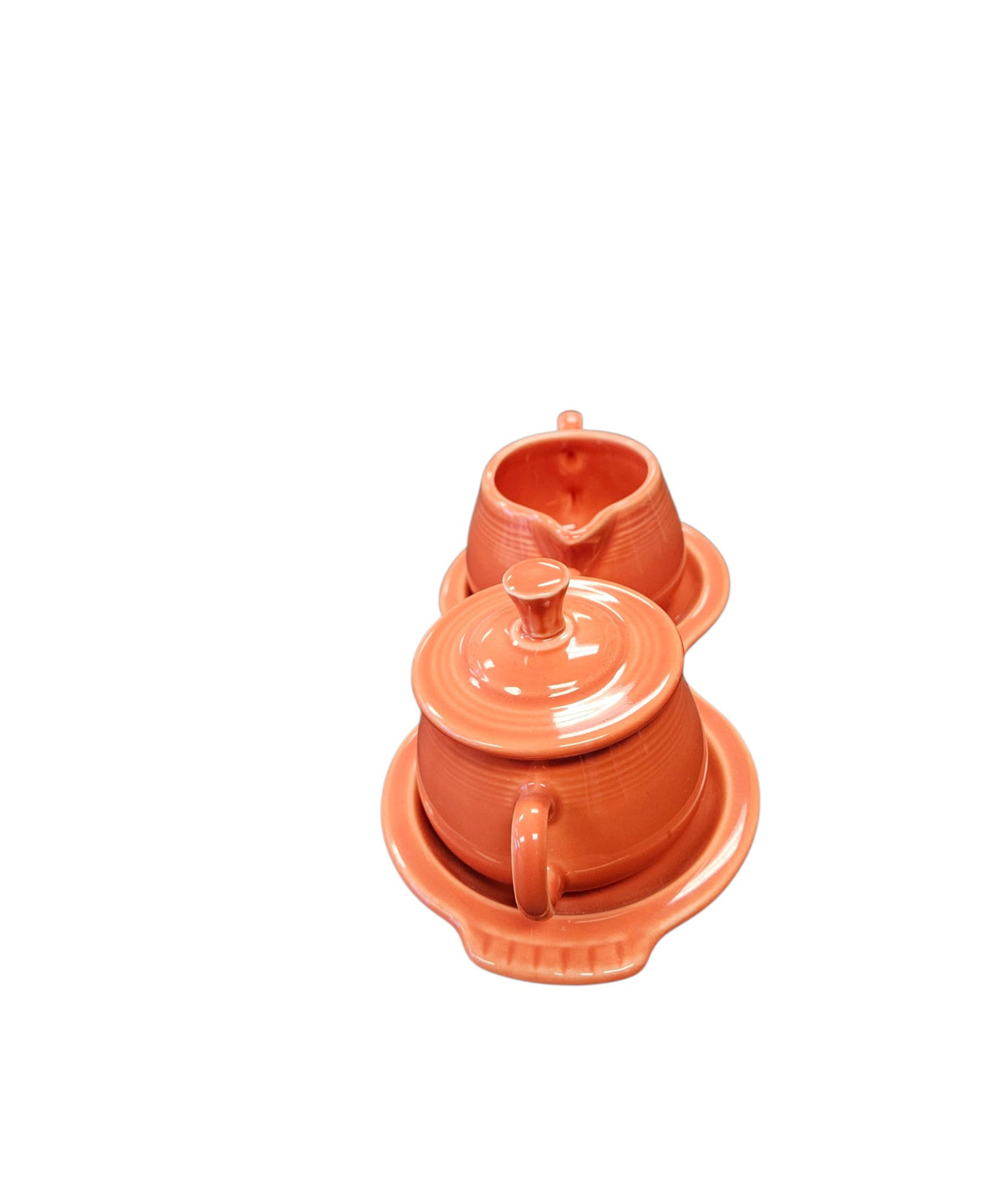 This is a Fiesta Fiestaware Creamer Pitcher Sugar Bowl with Lid on Figure Eight 8 Tray Set in persimmon lead-free, Post 1986, Retired Color Retired Shape
