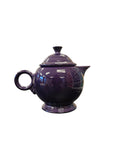 This is a Fiesta Fiestaware Five-cup 5-cup Ring Handled Tea Pot with Lid in Plum. lead-free, Post 1986, Retired Color Retired Shape

