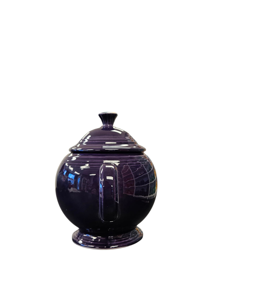 This is a Fiesta Fiestaware Five-cup 5-cup Ring Handled Tea Pot with Lid in Plum. lead-free, Post 1986, Retired Color Retired Shape
