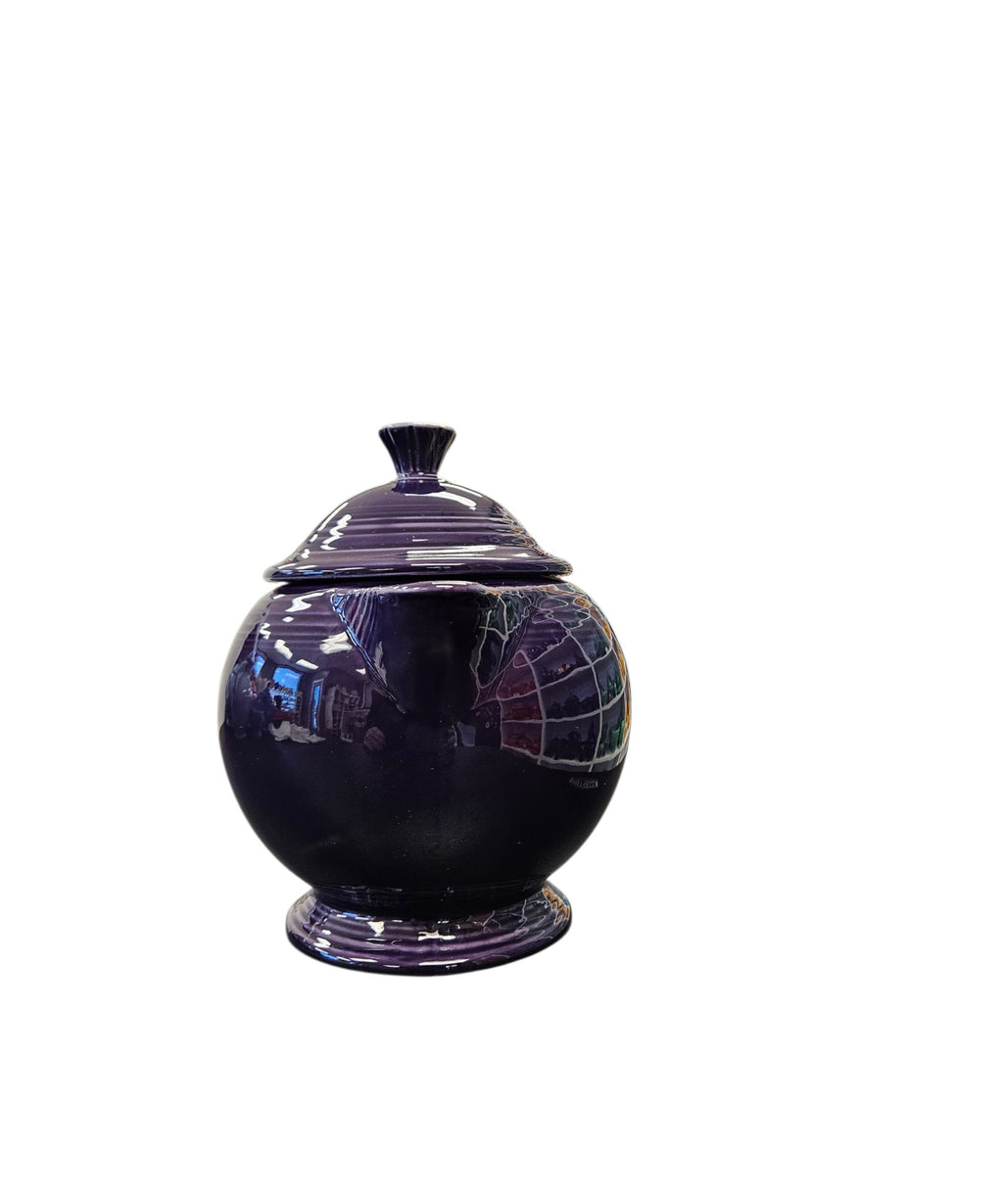 This is a Fiesta Fiestaware Five-cup 5-cup Ring Handled Tea Pot with Lid in Plum. lead-free, Post 1986, Retired Color Retired Shape
