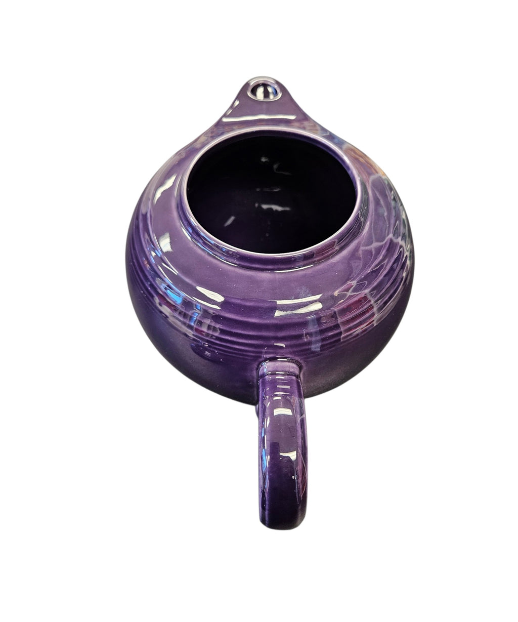 This is a Fiesta Fiestaware Five-cup 5-cup Ring Handled Tea Pot with Lid in Plum. lead-free, Post 1986, Retired Color Retired Shape
