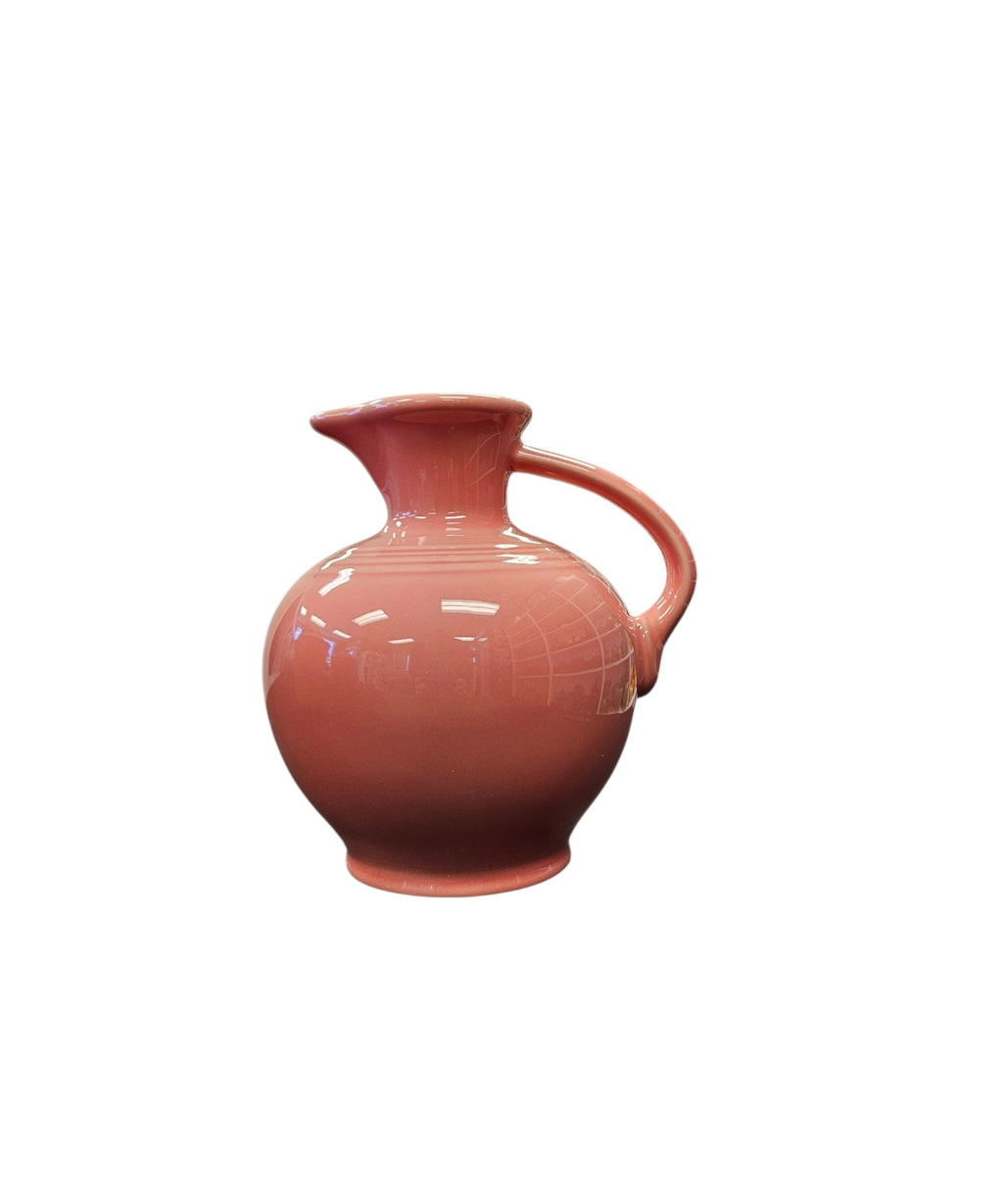 This is a Fiesta Fiestware small 60 Ounce Carafe in peony. Lead-free Post 1986 retired shape
