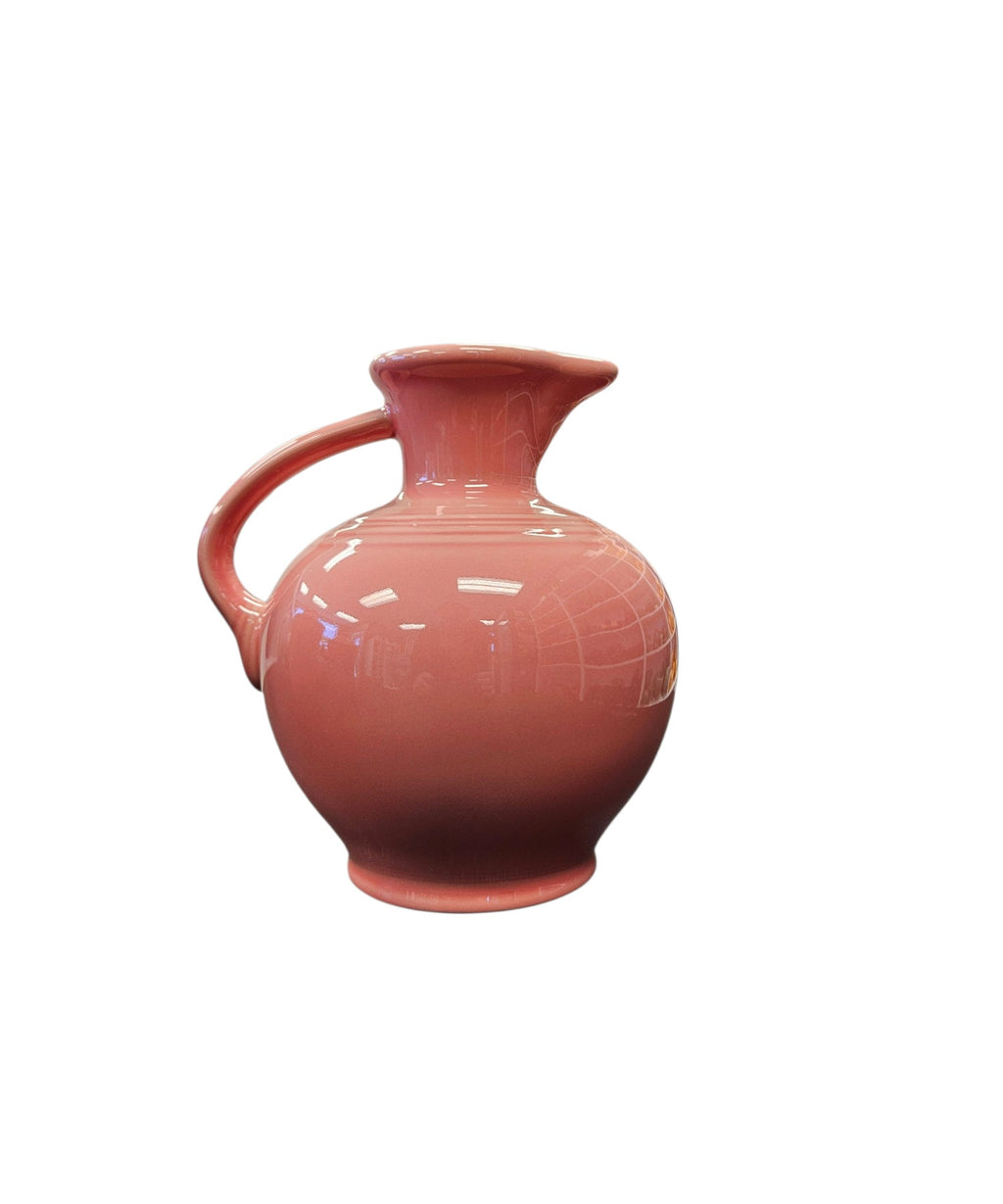 This is a Fiesta Fiestware small 60 Ounce Carafe in peony. Lead-free Post 1986 retired shape
