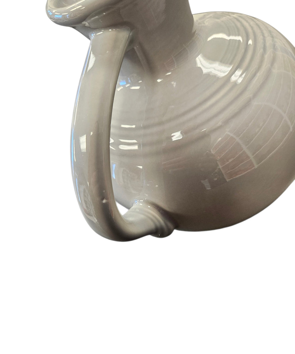 This is a Fiesta Fiestware small 60 Ounce Carafe in pearl-gray. Lead-free Post 1986 Retired color retired shape
