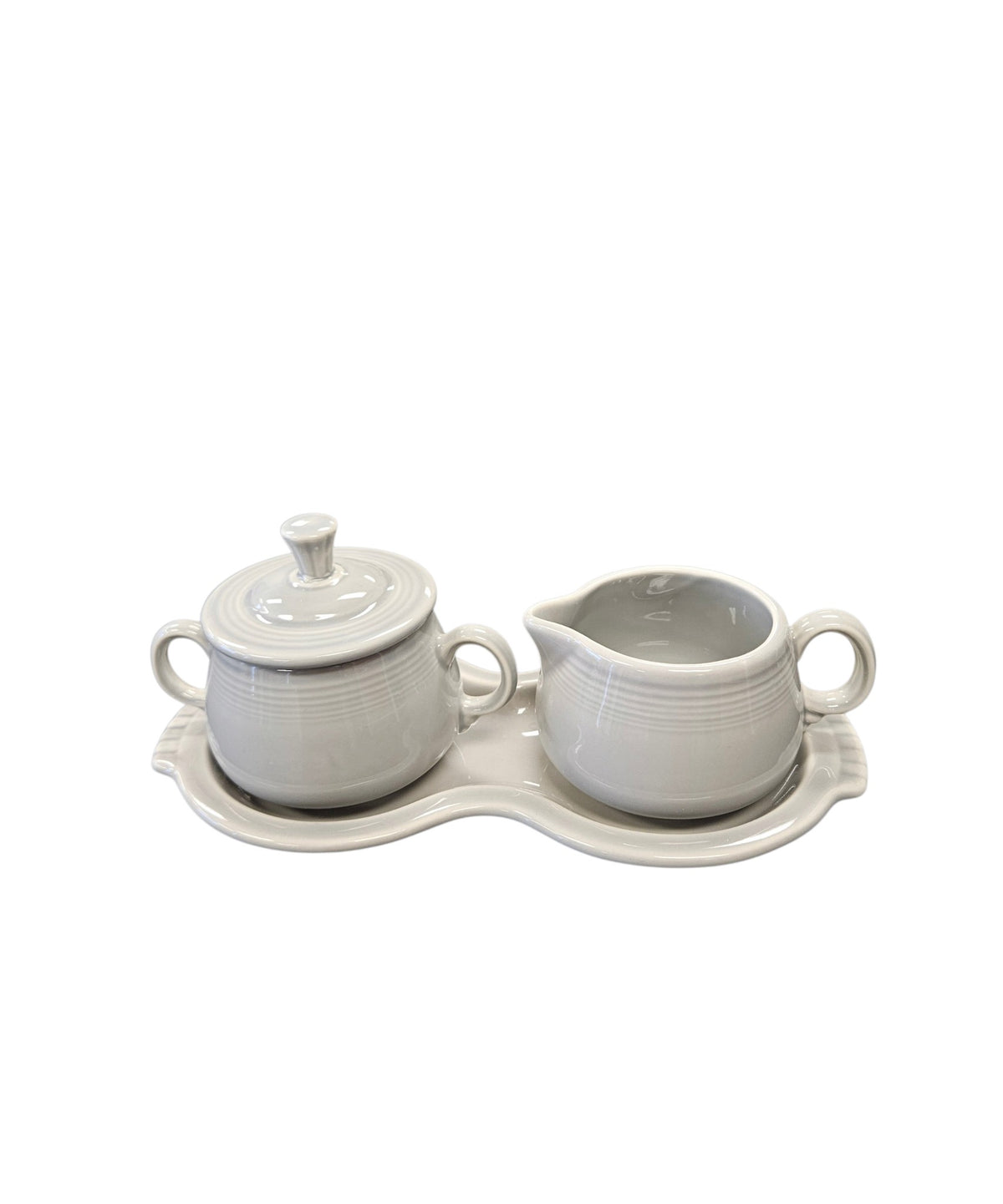 This is a Fiesta Fiestaware Creamer Pitcher Sugar Bowl with Lid on Figure Eight 8 Tray Set in pearl gray lead-free, Post 1986, Retired Color Retired Shape
