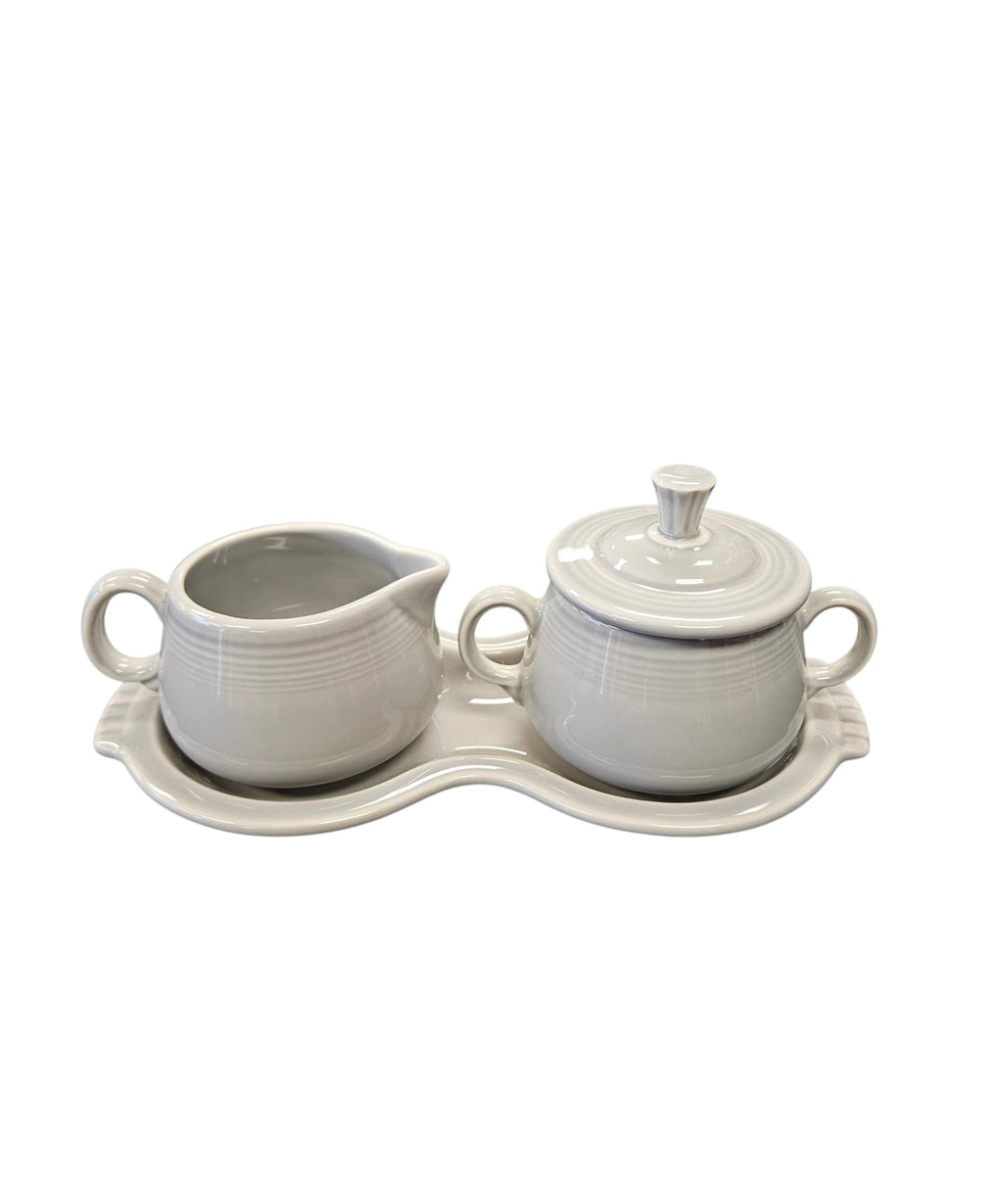 This is a Fiesta Fiestaware Creamer Pitcher Sugar Bowl with Lid on Figure Eight 8 Tray Set in pearl gray lead-free, Post 1986, Retired Color Retired Shape
