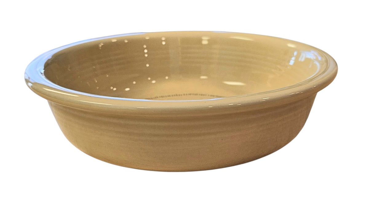 This is a Fiesta fiestaware Classic Rim Cereal Bowl featuring Everything Kitchen's Fall Forest decal on Ivory. Lead free, Post 1986 Retired Decal, Retired Color, limited quantities available via EK, Fall, Greenery, Cabin, Bird, Turkey, Tree, Thanksgiving
