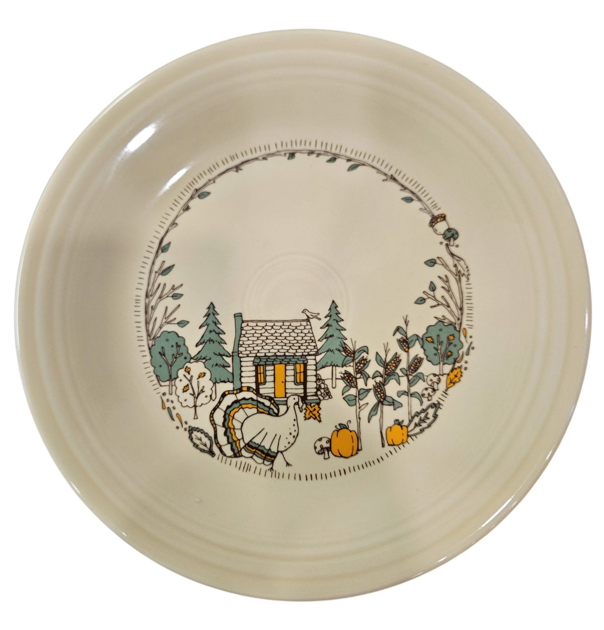 This is a Fiesta fiestaware Classic Dinner Plate featuring Everything Kitchen's Fall Forest decal on Ivory. Lead free, Post 1986 Retired Decal, Retired Color, no longer available EK, Fall, Pumpkin, Greenery, Cabin, Bird, Turkey, Thanksgiving
