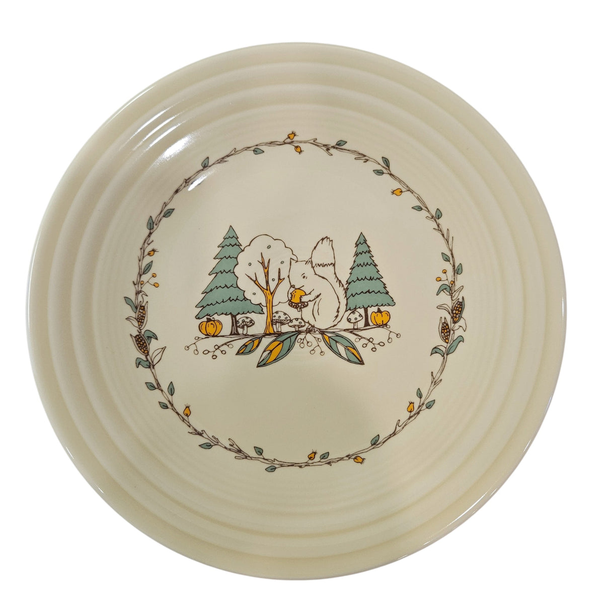 This is a Fiesta fiestaware Classic Luncheon Plate featuring Everything Kitchen's Fall Forest decal on Ivory. Lead free, Post 1986 Retired Decal, Retired Color, limited quantities available via EK, Fall, Pumpkin, Greenery, Bird. Acorn, squirrel, Thanksgiving
