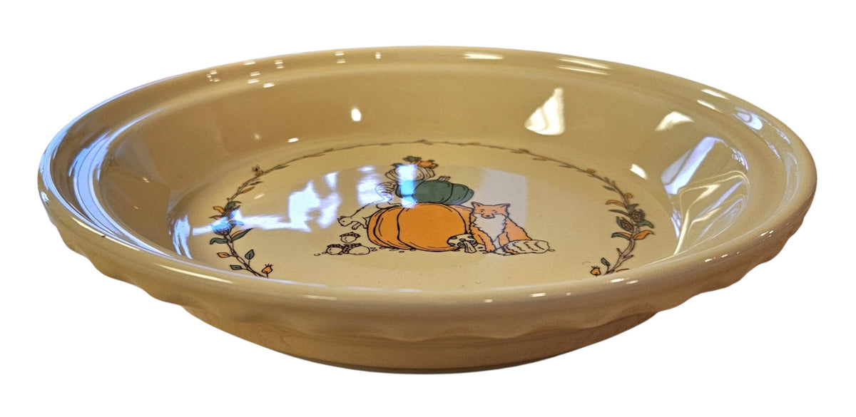 This is a Fiesta fiestaware Large Pie Baker featuring Everything Kitchen's Fall Forest decal on Ivory. Lead free, Post 1986 Retired Decal, Retired Color, limited quantities available via EK, Fall, Greenery, Cabin, Bird, Turkey, Tree, Thanksgiving
