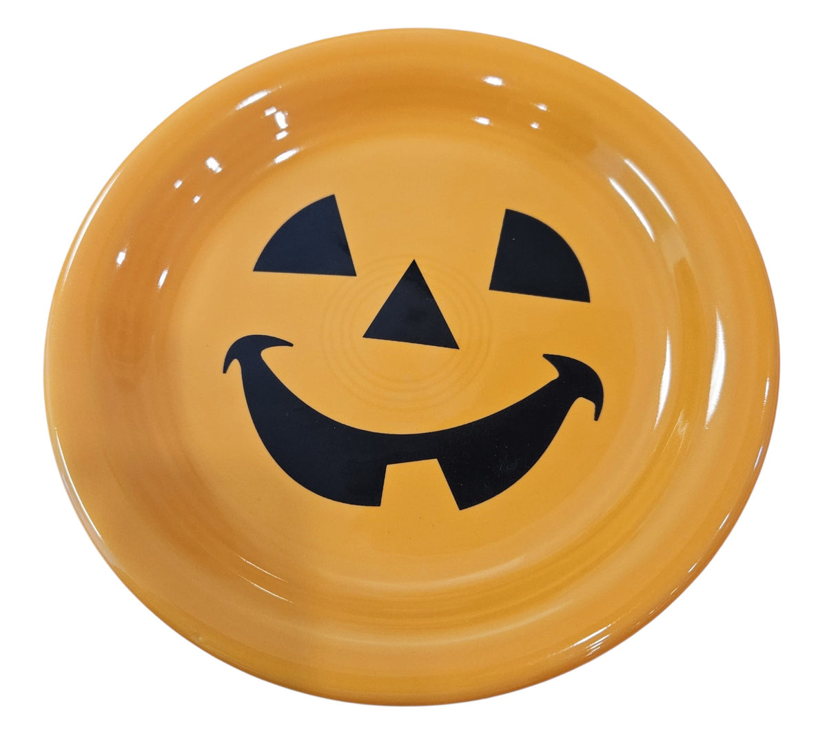 This is a Fiesta fiestaware Bistro Appetizer Plate featuring the Happy Pumpkin decal on tangerine. Lead free, Post 1986, Retired Production Decal, Retired Color, Fall, Thanksgiving, Halloween

