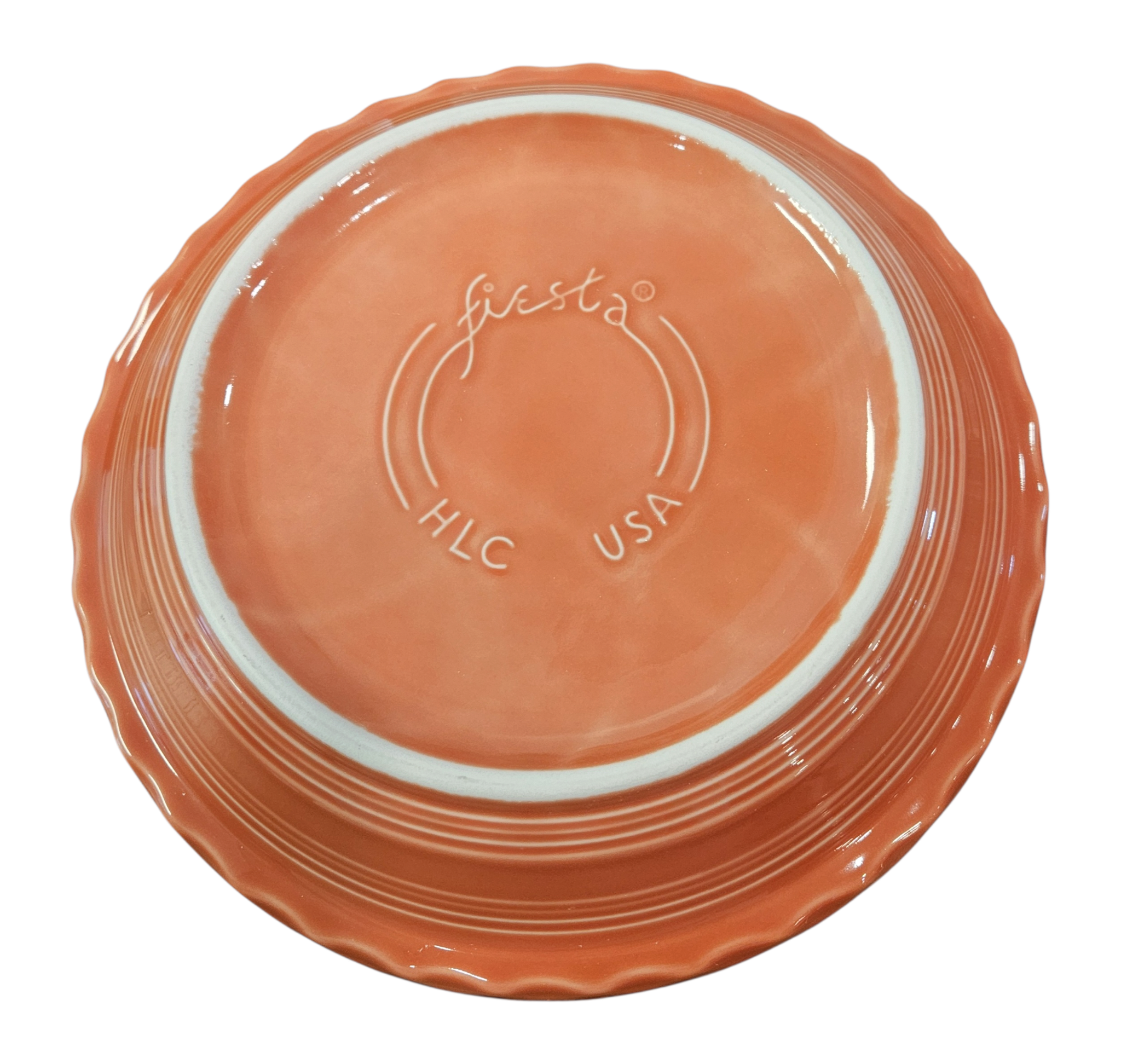 This is a Fiesta fiestaware Large Pie Baker featuring the Happy Pumpkin decal on persimmon. Lead free, Post 1986, Retired Production Decal, Retired Color, Fall, Thanksgiving, Halloween
