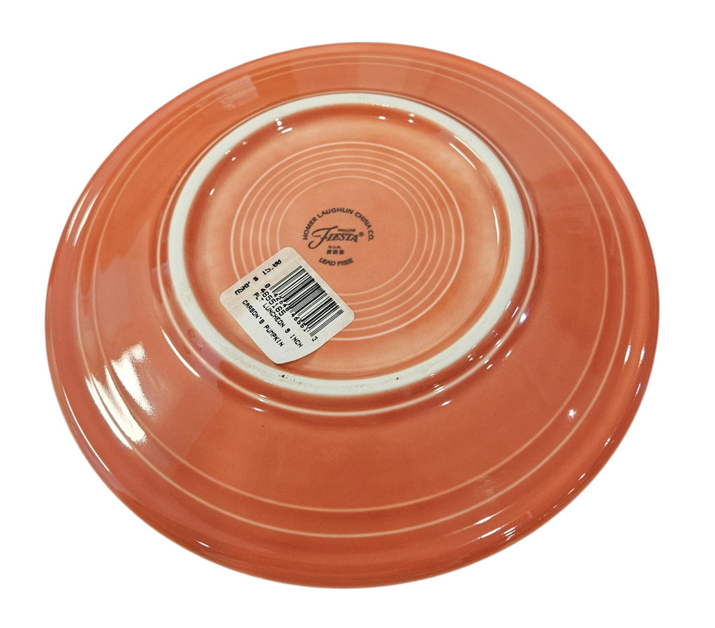This is a Fiesta fiestaware Classic Luncheon Plate featuring the Carson's Exclusive Pumpkin decal on persimmon. Lead free, Post 1986 retired decal, retired color, Halloween
