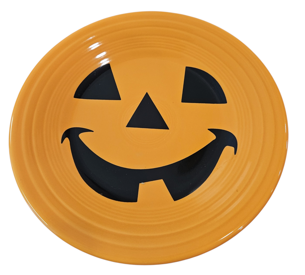 This is a Fiesta fiestaware Classic Luncheon Plate featuring the Happy Pumpkin decal on tangerine. Lead free, Post 1986, Retired Production Decal, Retired Color, Fall, Thanksgiving, Halloween
