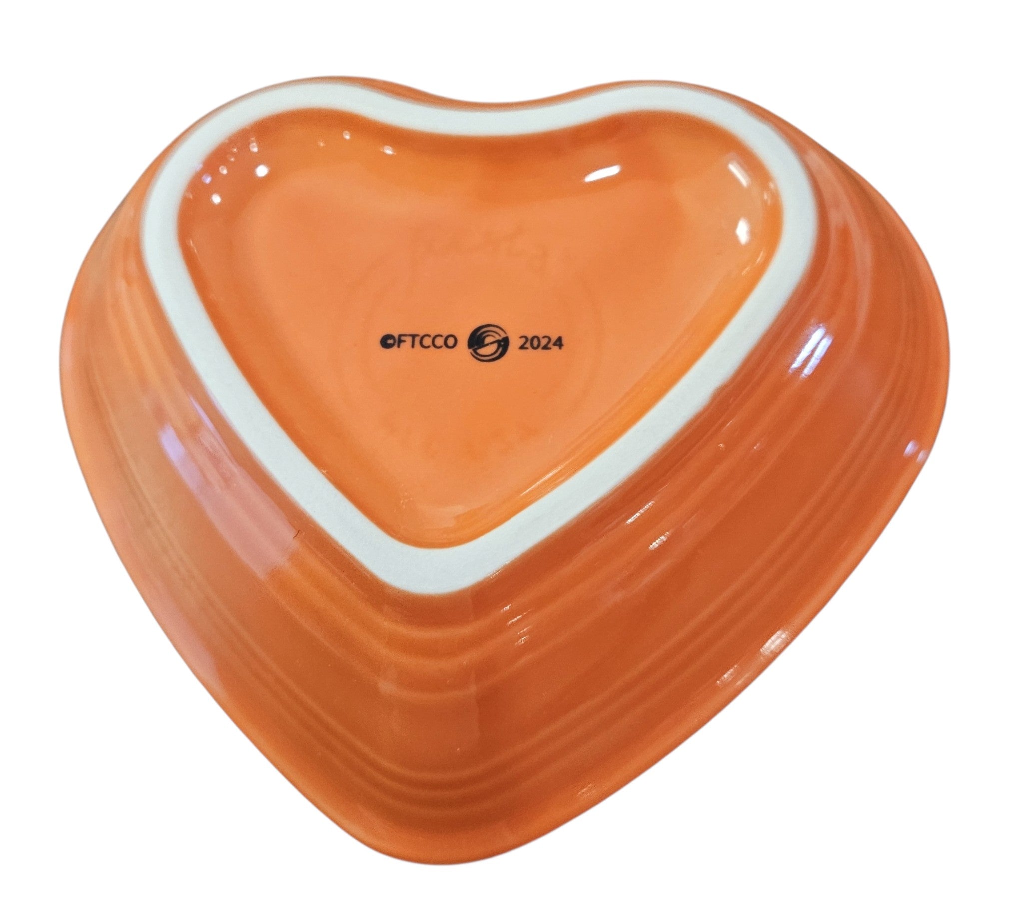 This is a Fiesta fiestaware Small Heart Bowl featuring the FTCCO 2024 exclusive Happy Pumpkin decal on poppy. Lead free, Post 1986, Fall, Thanksgiving, Halloween
