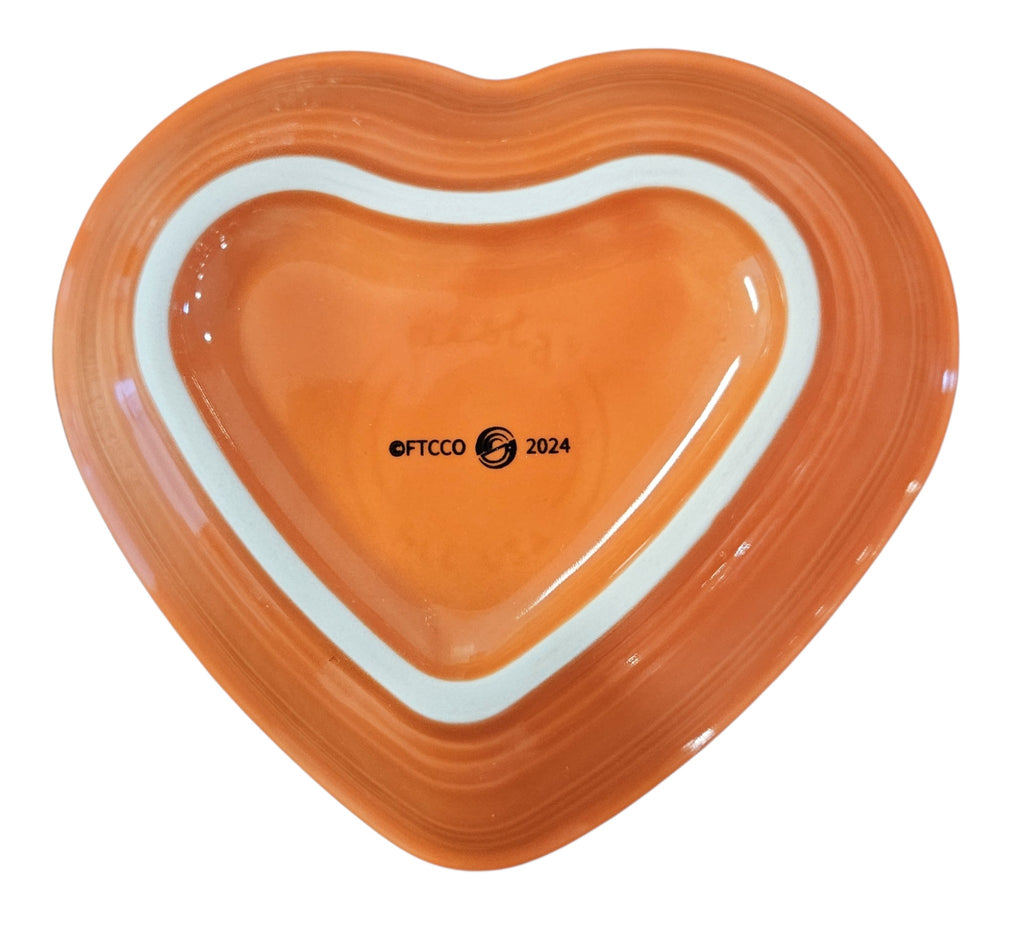 This is a Fiesta fiestaware Small Heart Bowl featuring the FTCCO 2024 exclusive Happy Pumpkin decal on poppy. Lead free, Post 1986, Fall, Thanksgiving, Halloween
