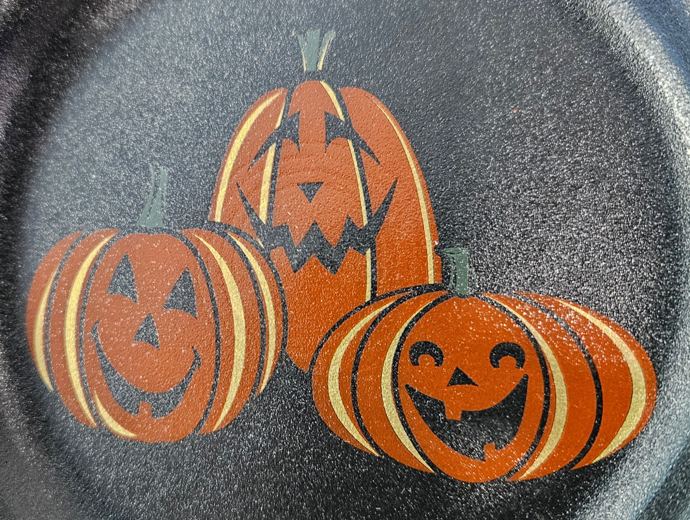 This is Fiesta fiestware Bistro Appetizer Plate featuring the Trio of Happy Pumpkins decal on black/foundry. Lead free, post 1986, retired decal, limited production color, Halloween

