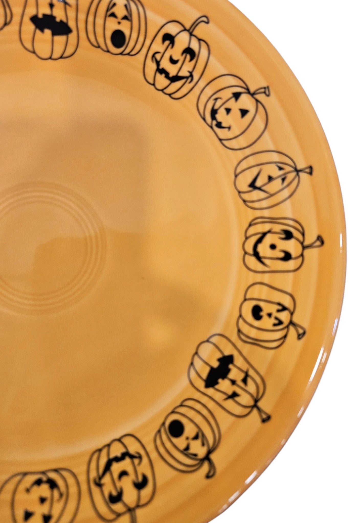 This is a Fiesta fiestaware Classic Luncheon Plate featuring the Carson's Exclusive Jack O' Lanterns decal on tangerine. Lead free, Post 1986 retired decal, retired color, Halloween

